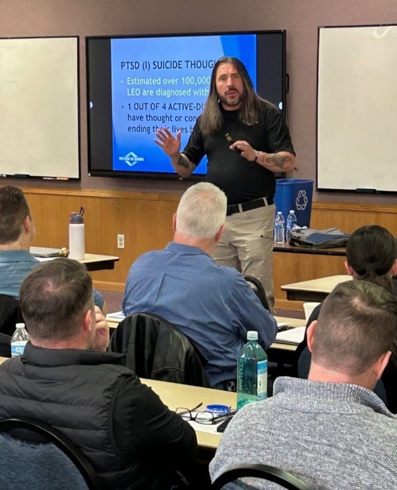 A Protecting The Guardian certified instructor teaching a department training class